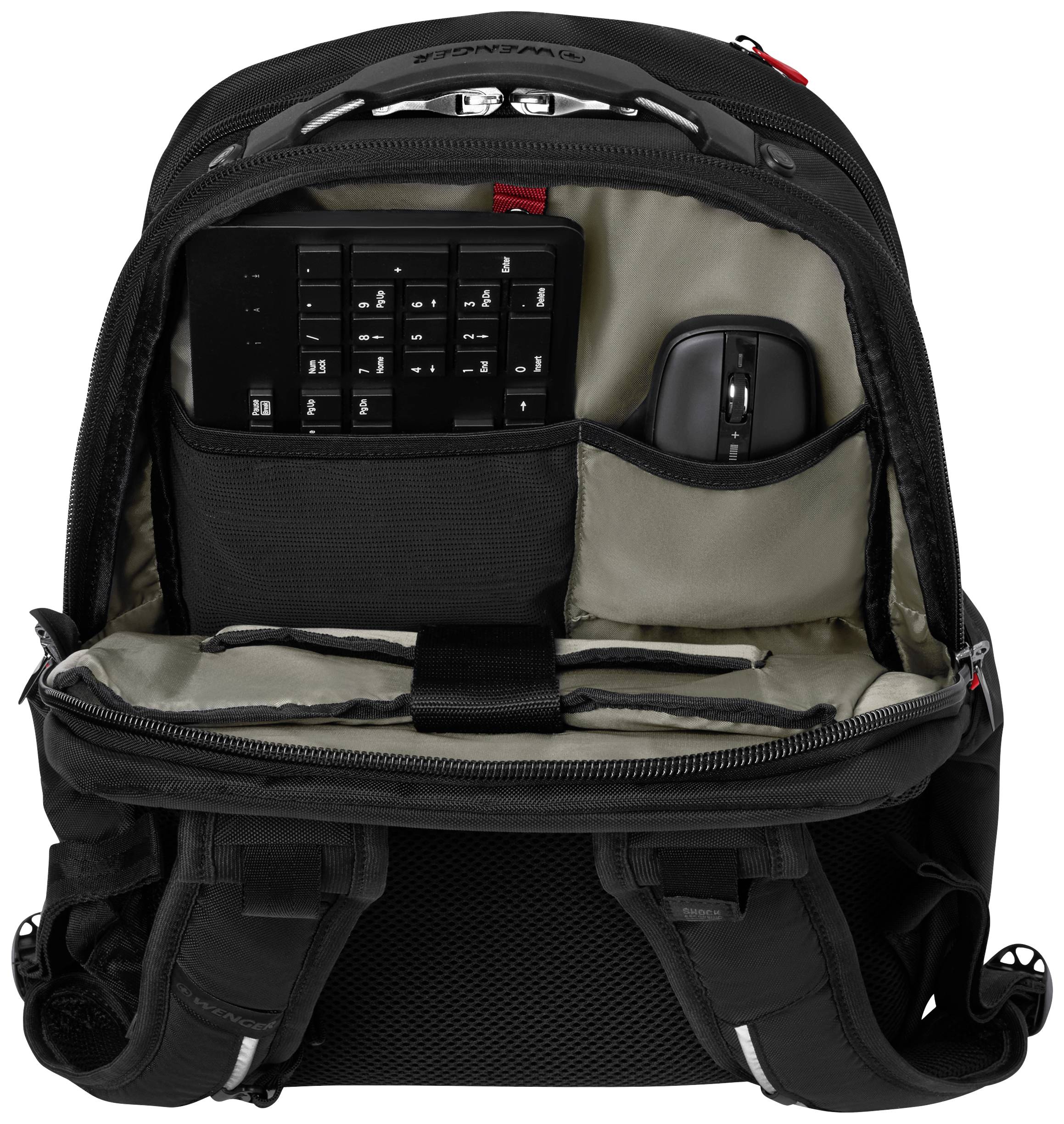 Opened black rucksack with an organised interior compartment containing a keyboard and a mouse. Ideal for tech accessories.