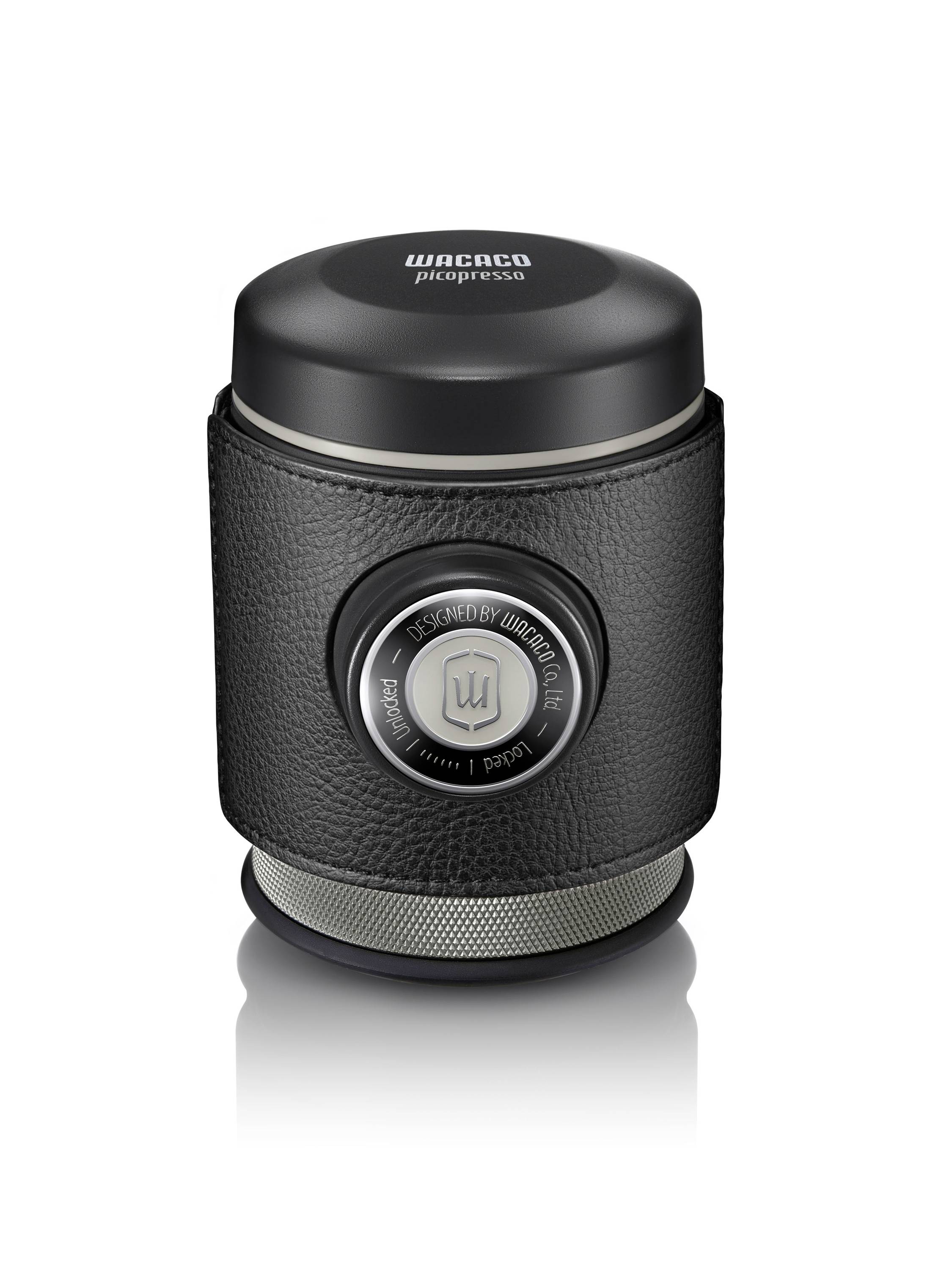 A portable espresso machine attachment with a black cover and a central push button, ideal for preparing coffee on the go.