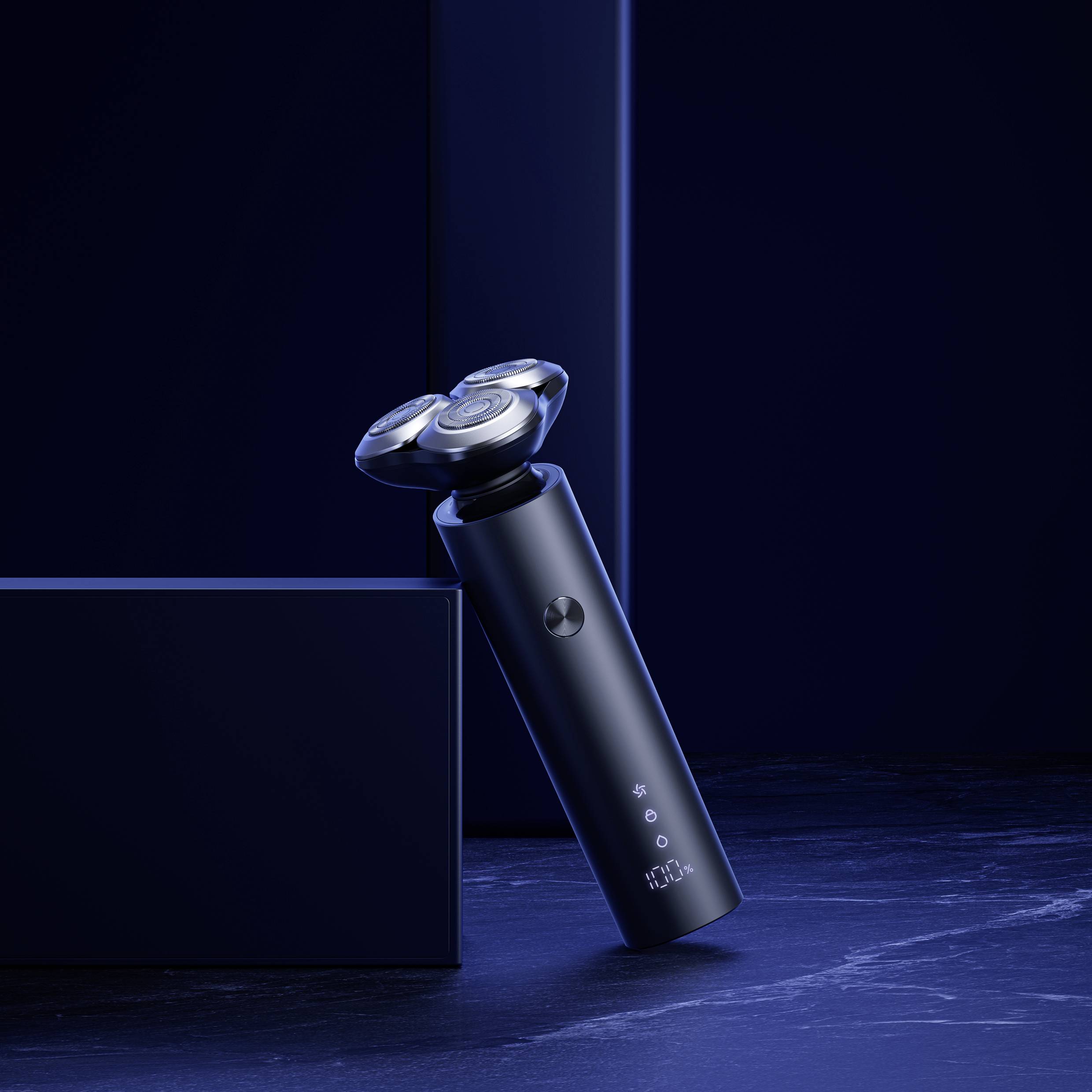 Electric razor in an elegant, dark design, standing on a dark surface, surrounded by minimalist-styled boxes.