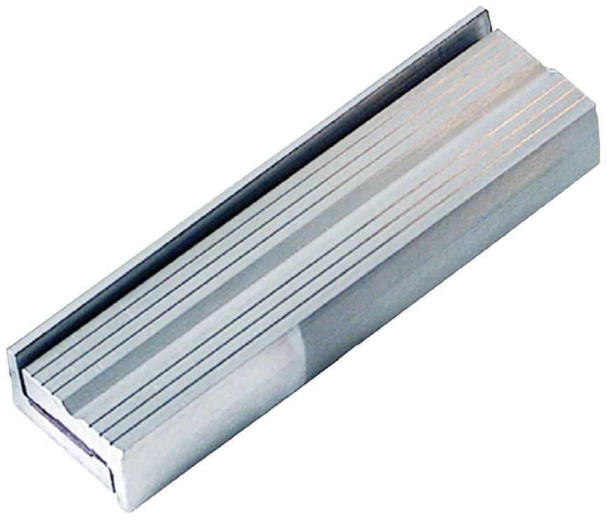 Metallic rectangular object with parallel lines on its surface, potentially a component of a mechanism or tool.