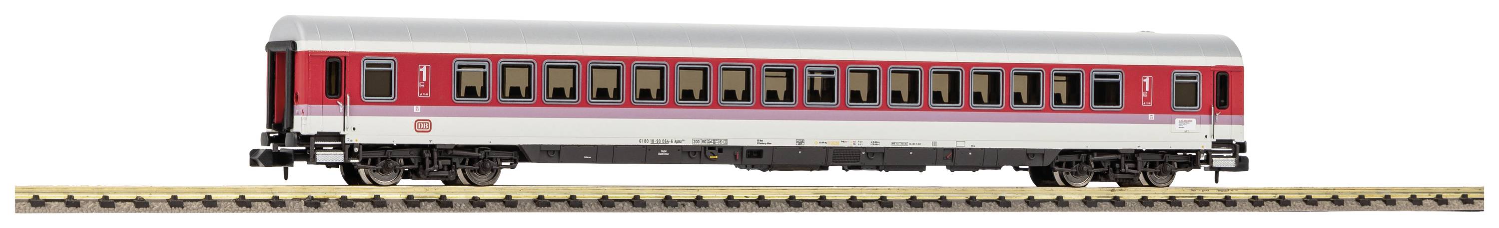 A red and silver railway carriage on a track. The carriage has rectangular windows along its side.