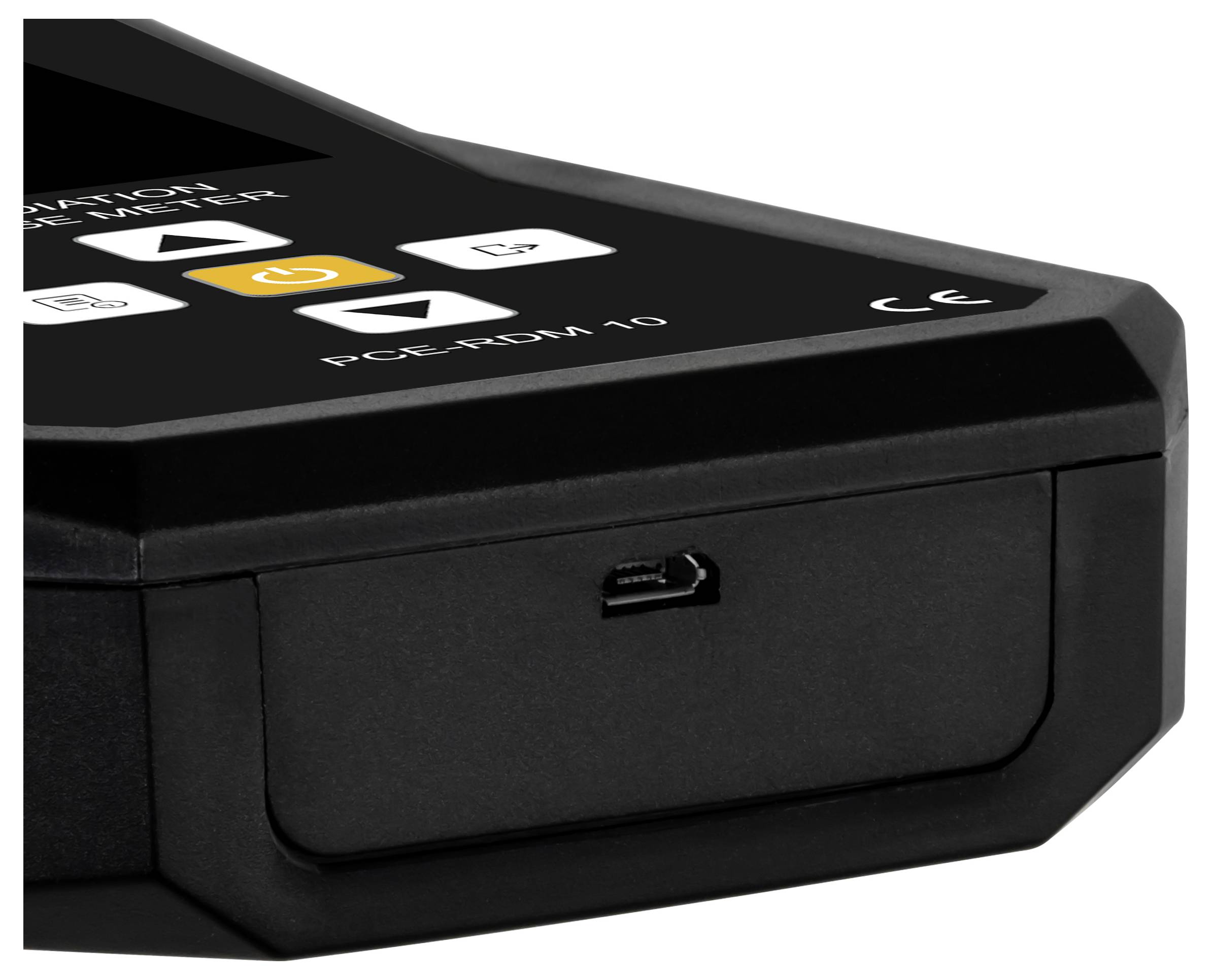 Close-up of a black device or equipment unit with a front port or slot and top control buttons, including an orange power button and 'PC-CARD' label.