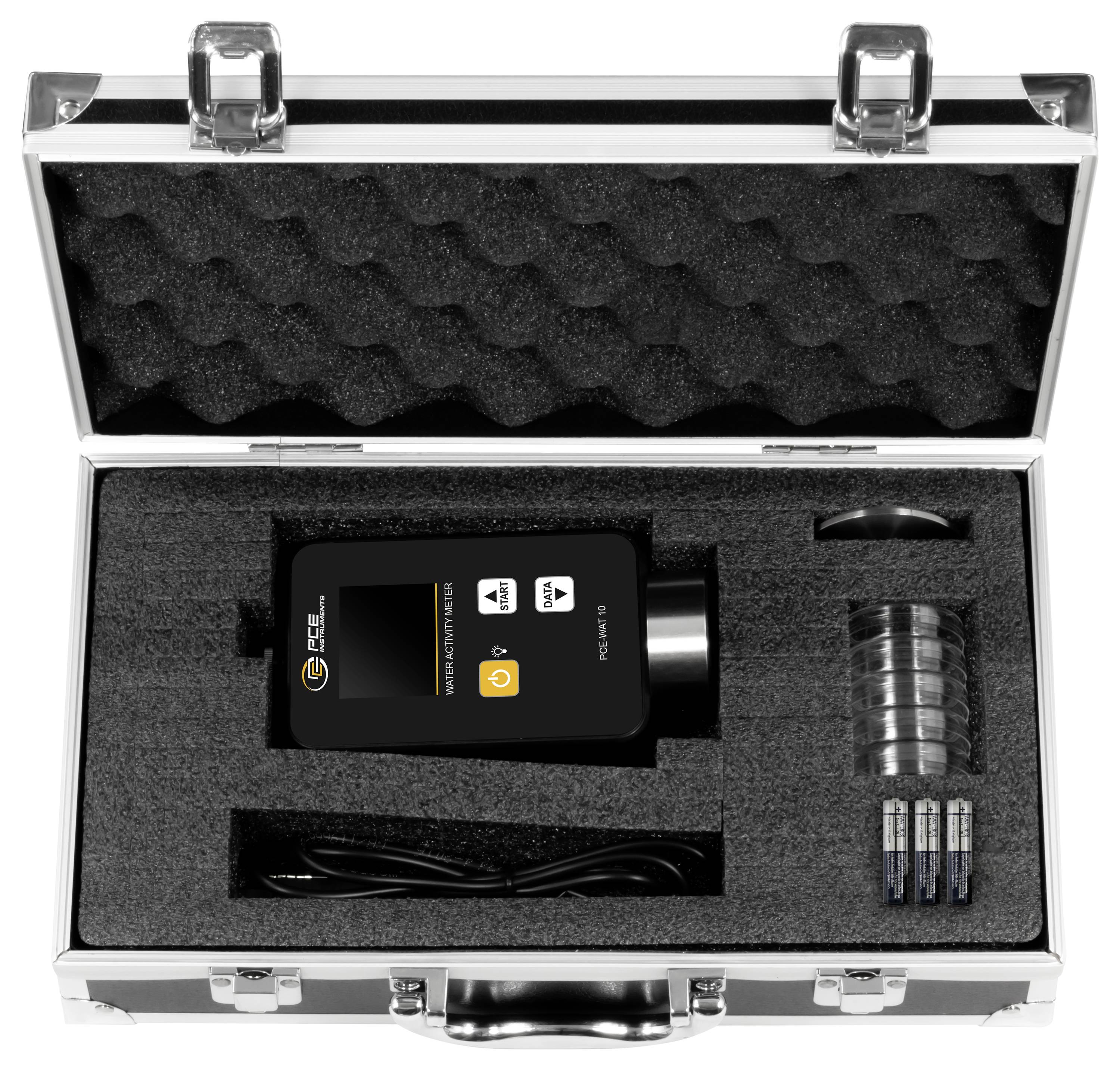 Open metal carrying case with foam insert holding a black handheld device, cable, batteries, and clear attachment accessories.