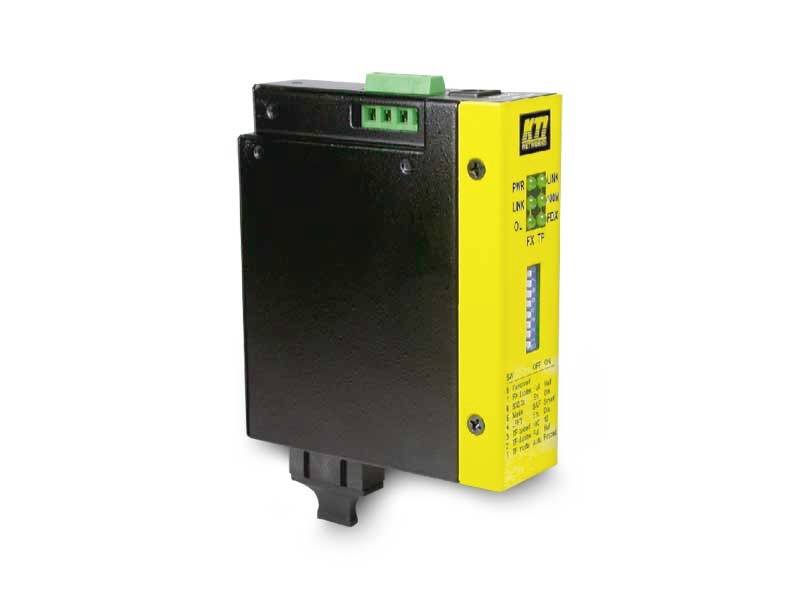 A yellow and black electrical device with multiple connection points and a switch for adjustment, most likely a modem or switching device.