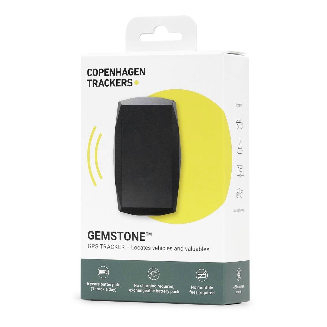 Copenhagen Trackers 'Gemstone' GPS Tracker Packaging. White cardboard box with an image of the black device on the front. Text: '6 Year Battery, No Fees'.