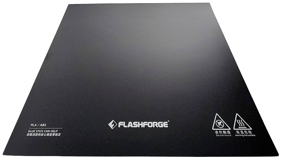 3D printer platform by FlashForge with markers for PLA/ABS usage. Dark, smooth surface with safety symbols.