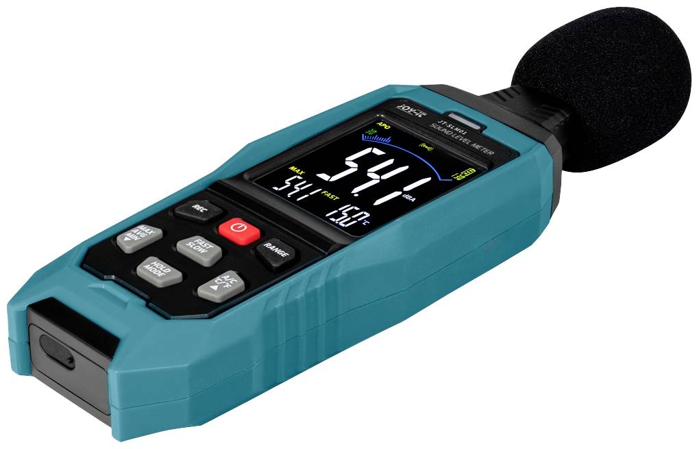 A turquoise sound level meter with a digital display shows the decibel value. The device has multiple buttons and a microphone.