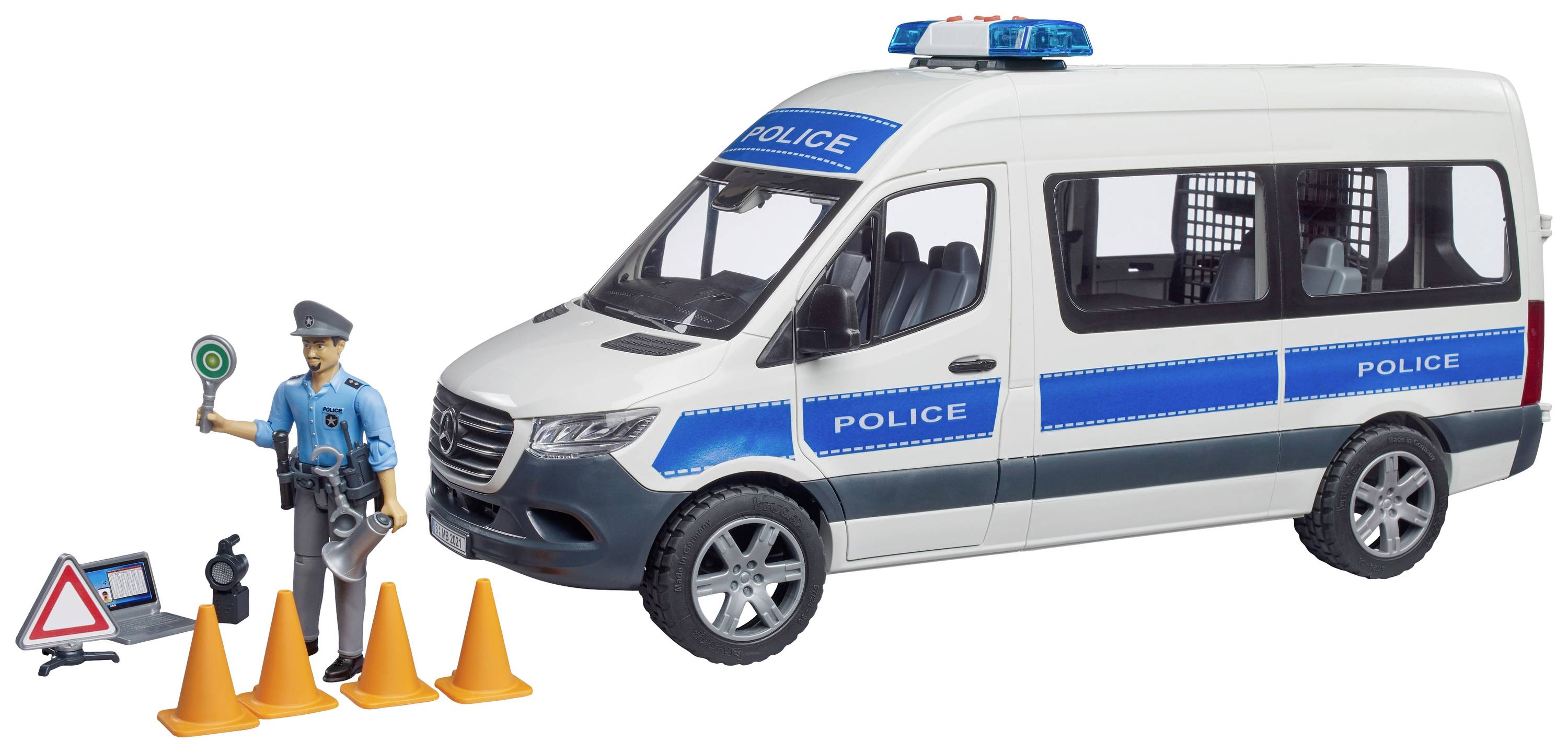 A toy police car with a police figure. Four orange cones and a toy warning sign are positioned in front of the vehicle.