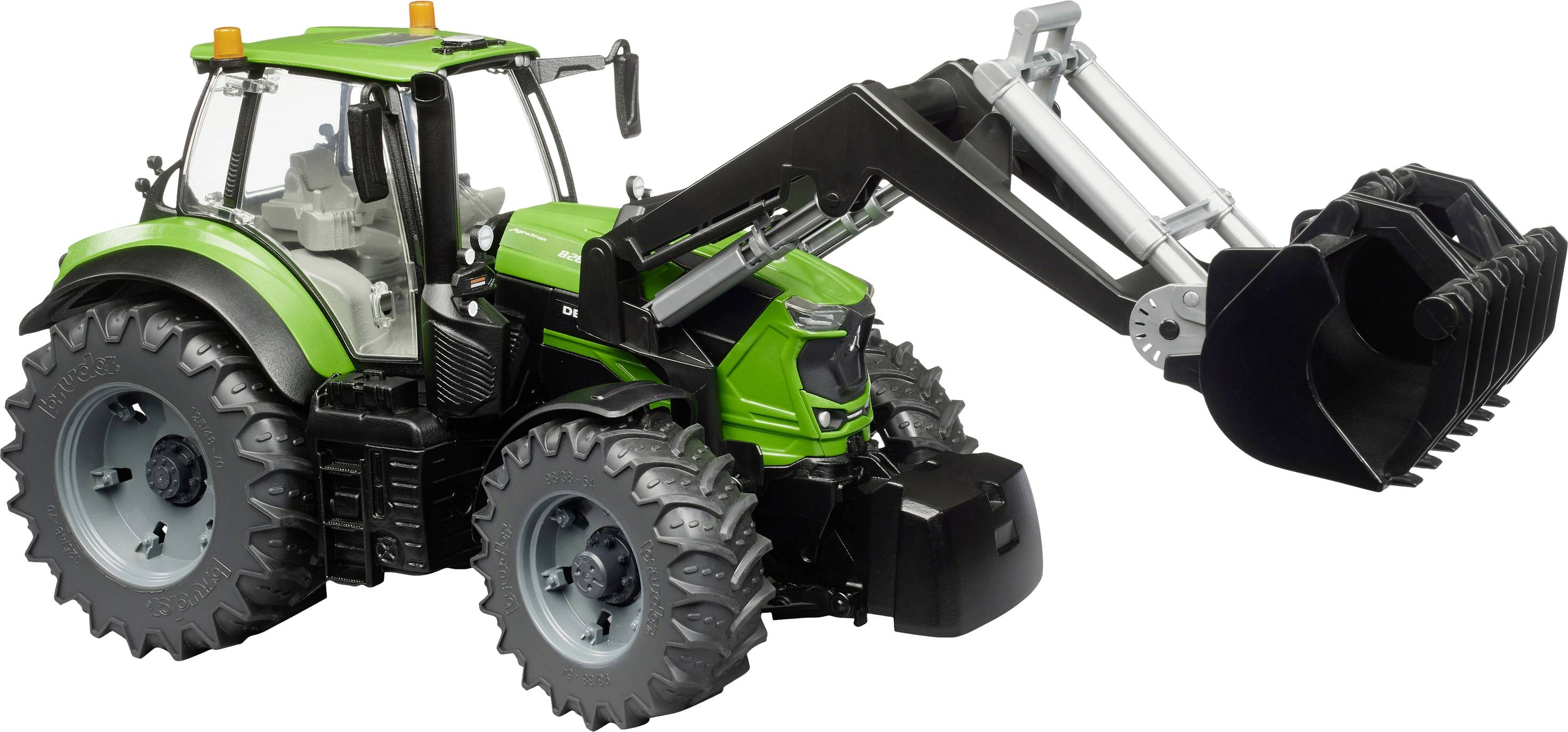 A green tractor with a front loader is positioned sideways. The loader is raised, and the tyres are large and heavily treaded.