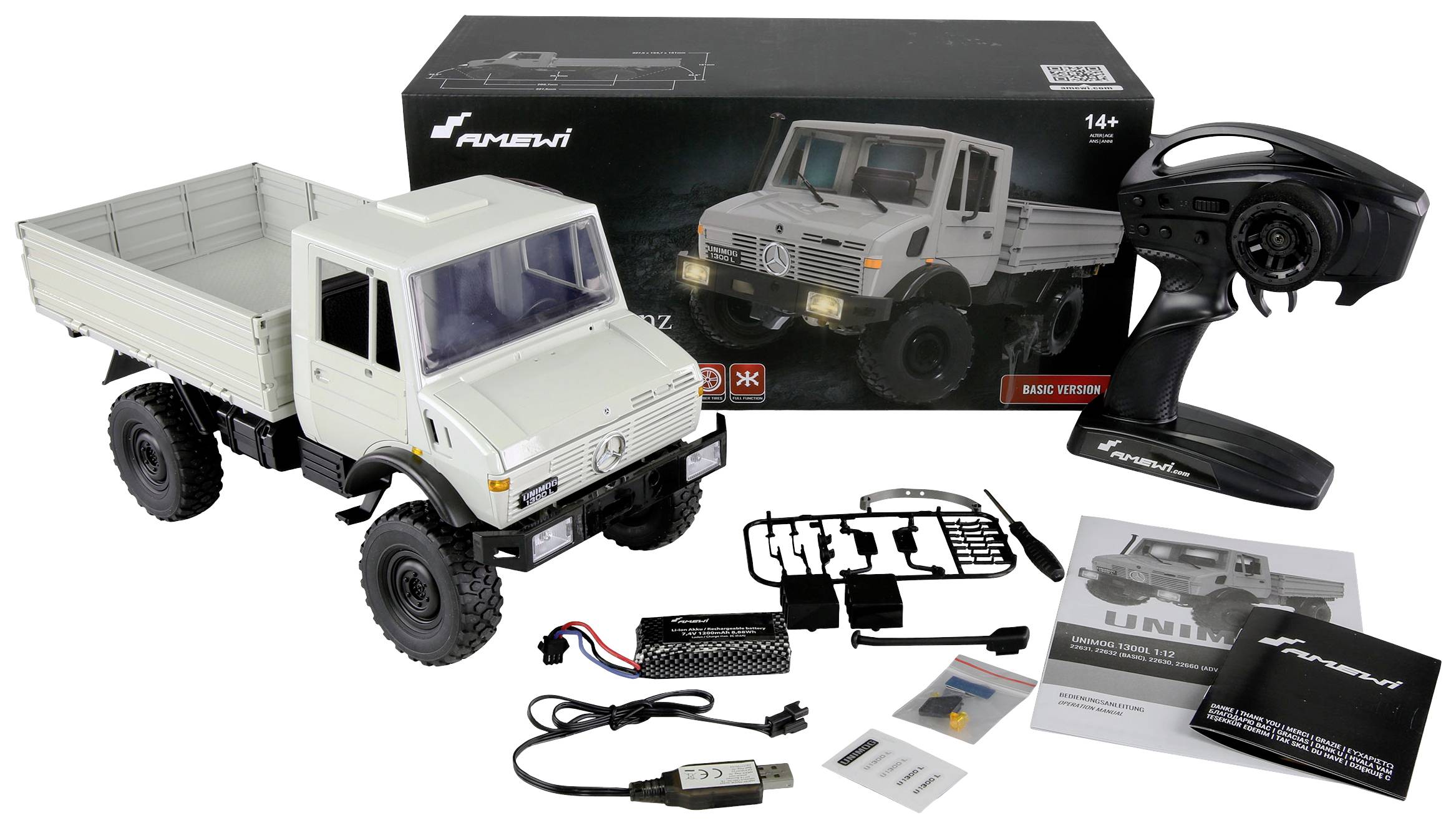 Remote-controlled model of a grey lorry with accessories such as remote control, batteries, and cable, shown in front of its packaging.