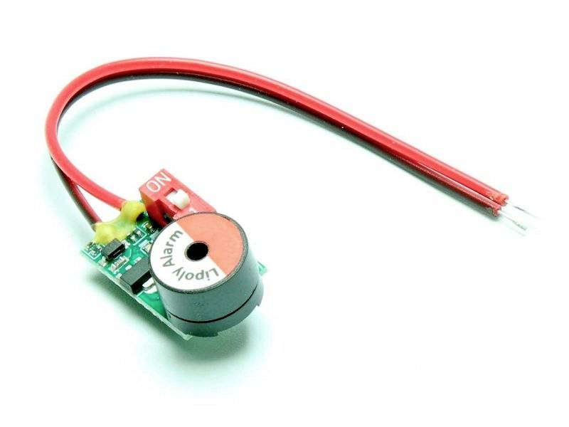 A small alarm buzzer with a red and a black cable. The buzzer has the inscription 'Alarm Lipo!' on the top surface.
