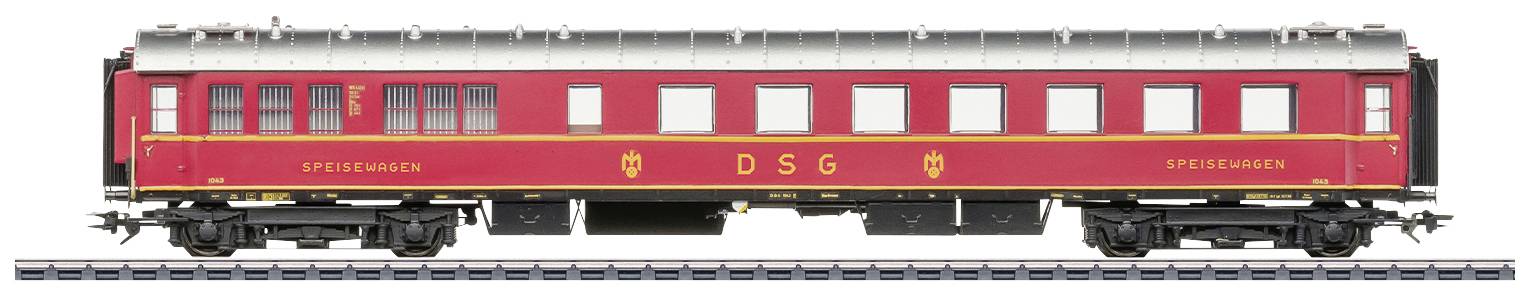 Red DSG dining car model train on track, side view, with yellow lettering 'DSG' and 'Dining Car'.