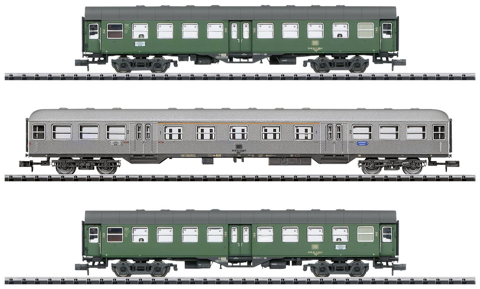 Model railway with three green carriages on tracks. Two carriages above and below are green with white windows; the middle one is grey.