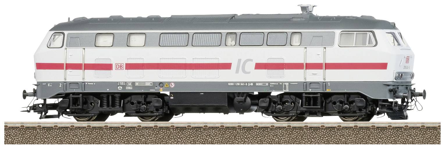 A grey and white Deutsche Bahn locomotive with a red stripe is standing on a railway track.