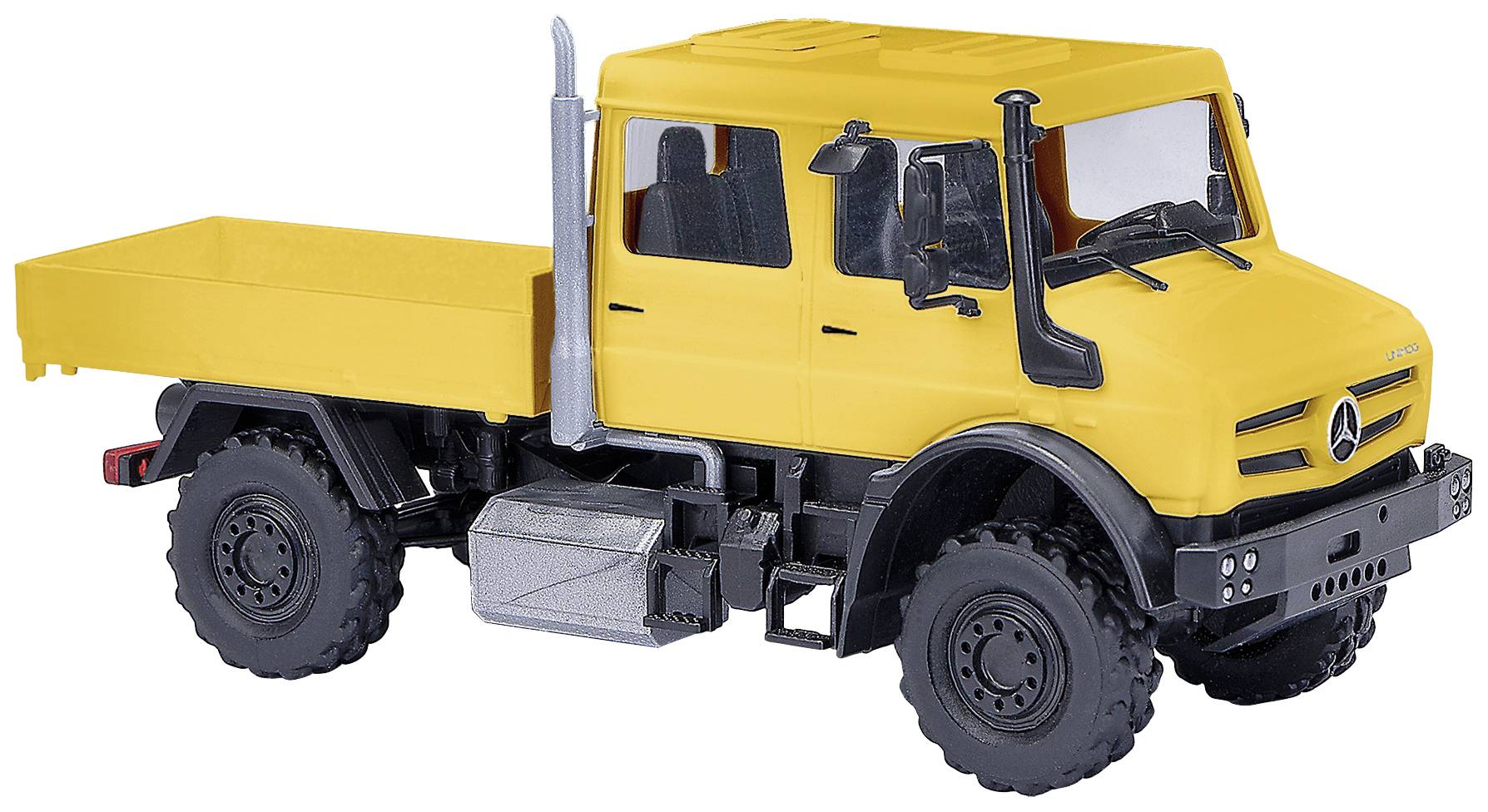 Yellow model of an all-terrain lorry with an open load bed, robust tyres, and silver exhaust on a white background.