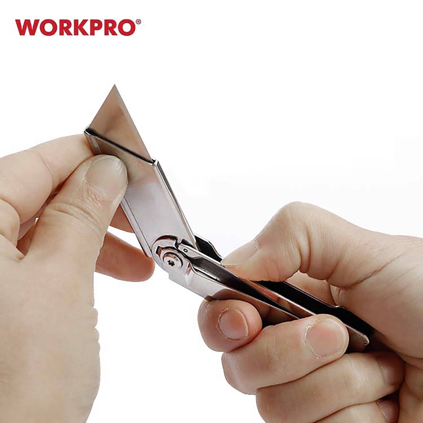 Hands holding a Stanley knife by 'WORKPRO', blade being replaced.