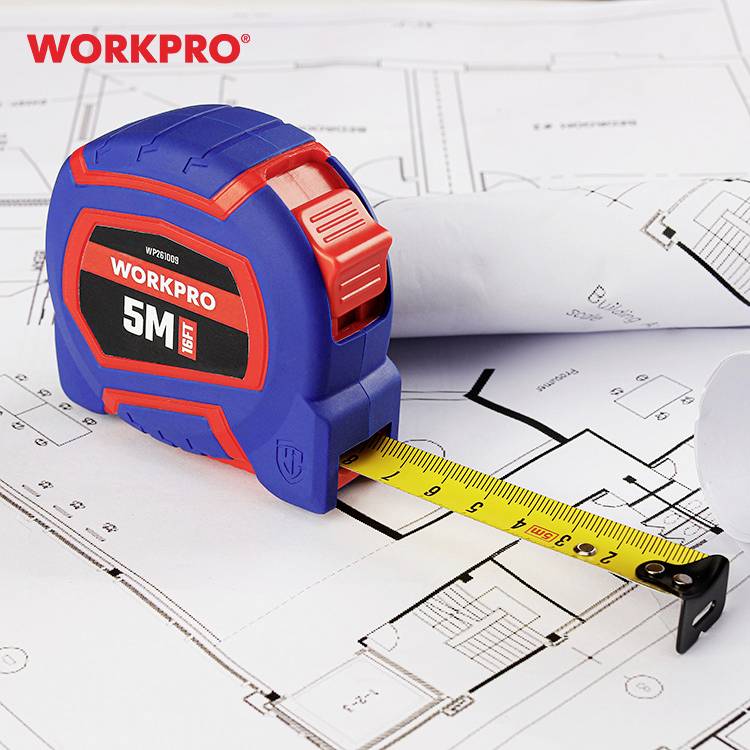 A red and blue tape measure showing 5 metres lies on unrolled architectural plans. The brand name 'WORKPRO' is located in the top left corner.