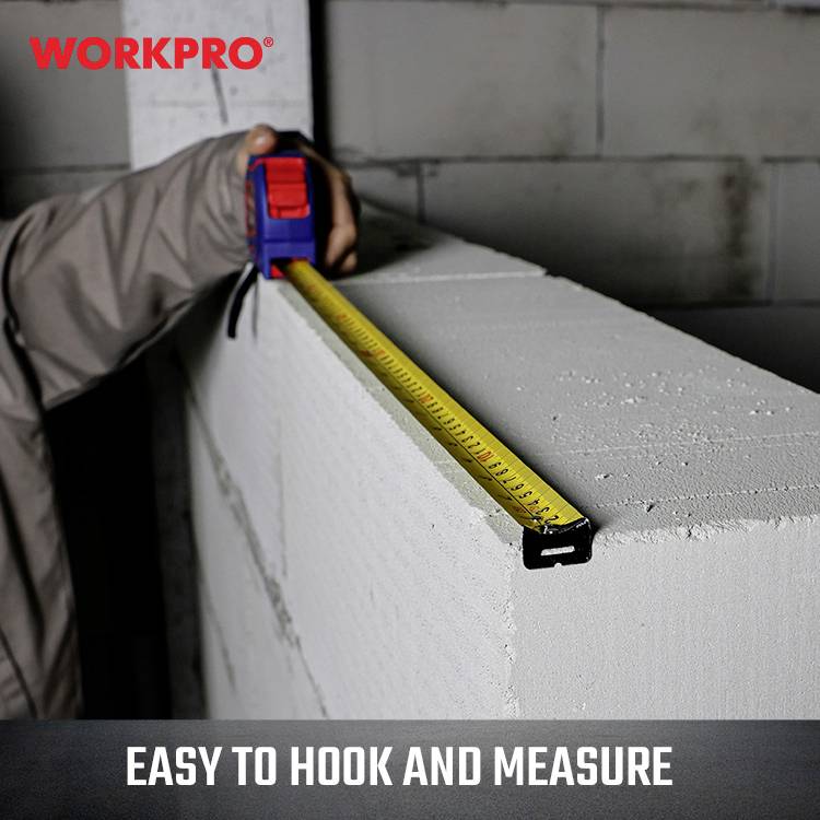 A hand is measuring a brick wall with a yellow and black tape measure. 'WORKPRO' is written in the top left, with 'EASY TO HOOK AND MEASURE' at the bottom.