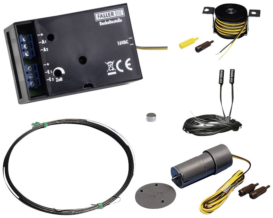 Electrical kit with transformer, cables, wire coil, magnet and motor. Components for controlling model railways.
