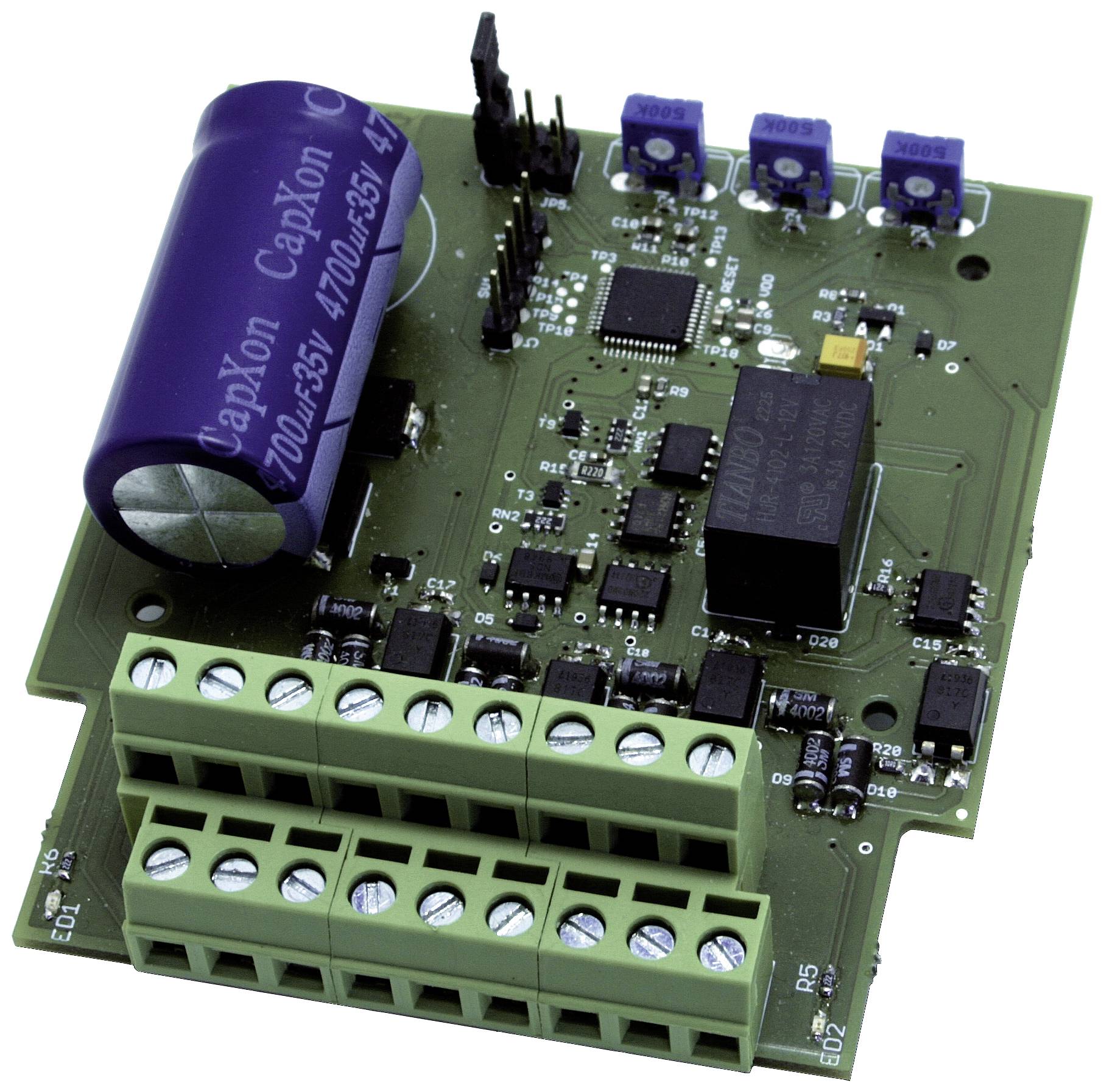 Electronic circuit board with multiple blue and green components, including capacitors and connectors, on a green substrate.