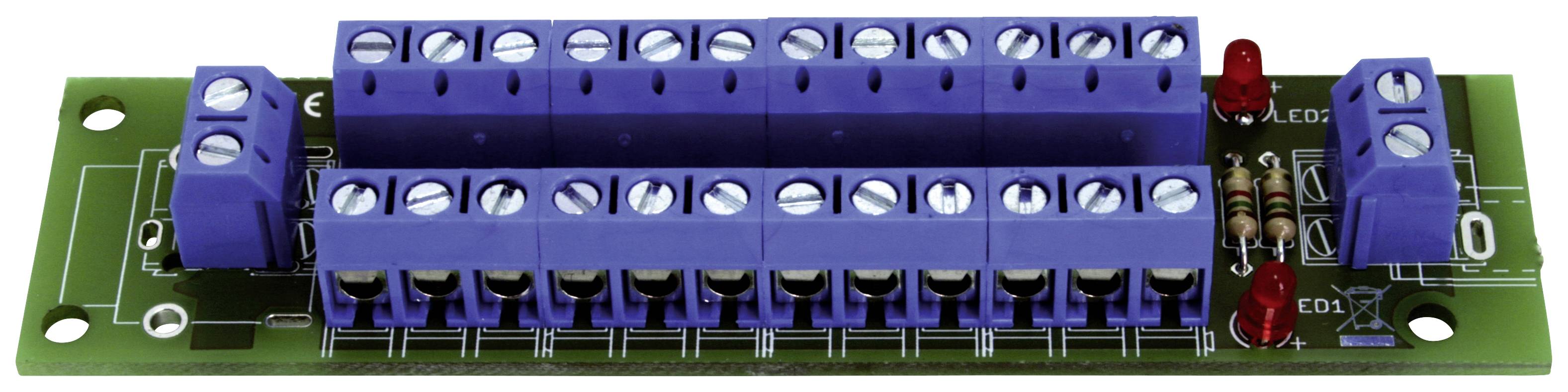 Component assembly with a green printed circuit board and purple terminal strips, potentially for electrical connections.