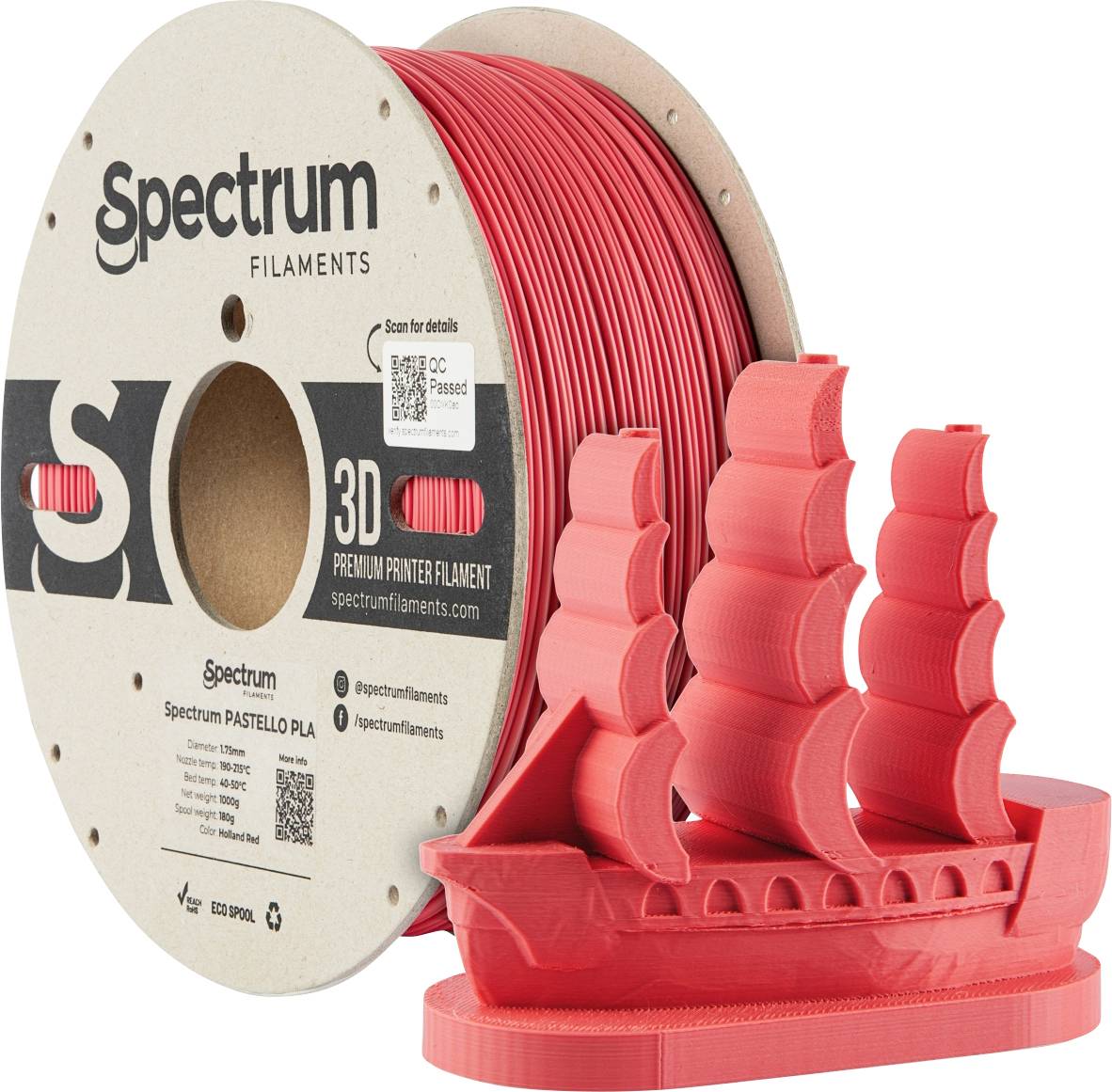 Role of red filament next to a 3D-printed model of a sailing ship. Text on the reel: 'Spectrum Filaments', '3D Premium Printer Filament'.