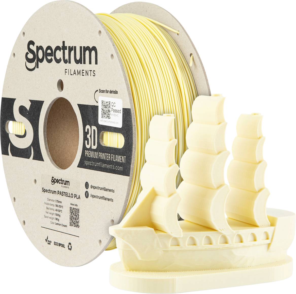 A reel of yellow 3D printer filament beside a model sailing ship that has been printed using this filament.