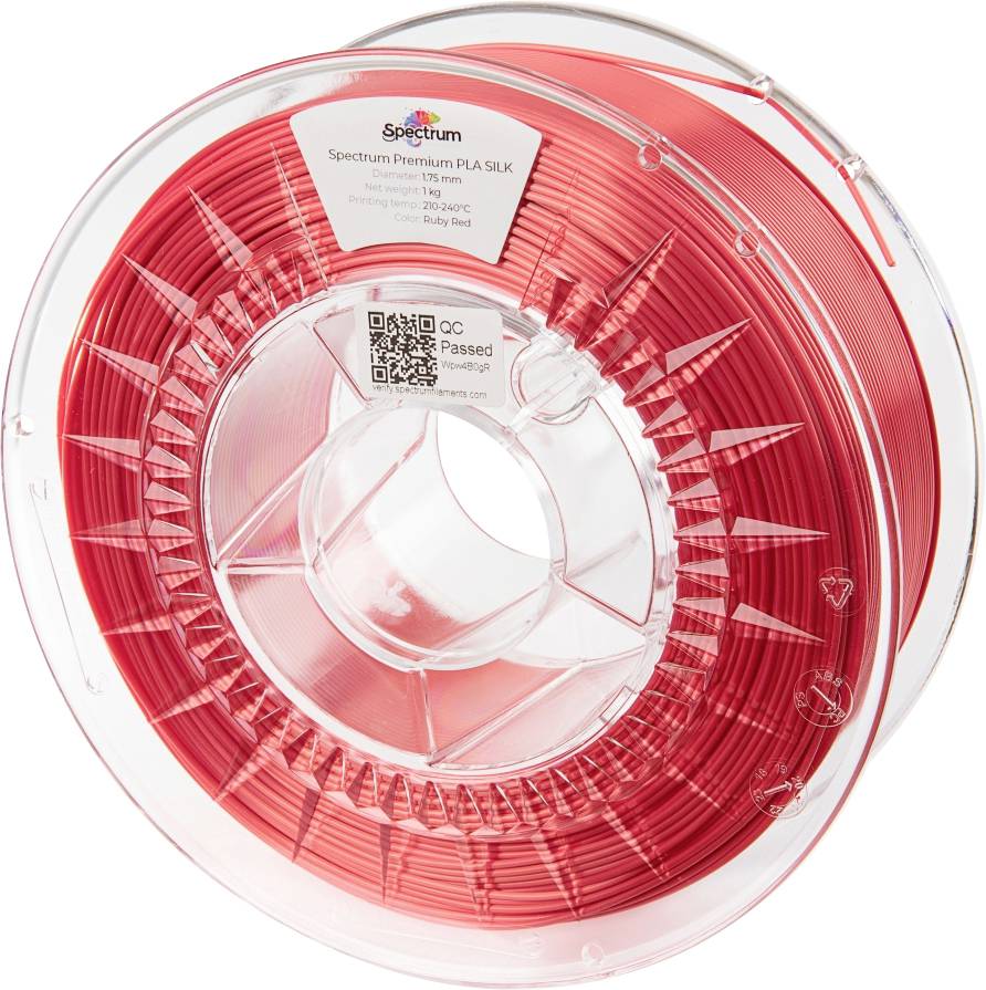 Spool of red PLA filament for 3D printer, Spectrum Premium brand, label text: 'PLA SILK, Ruby Red, 1.75mm, 1kg'.