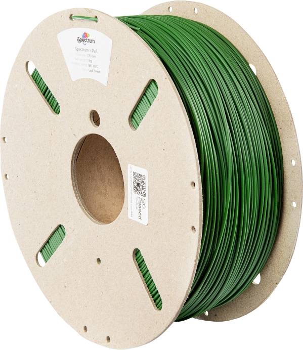 Green PLA filament spool from Spectrum, wound on a cardboard core.