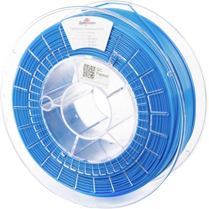 A transparent spool with blue filament for 3D printers. Label with 'Spectrum Premium PCTG' and QR code visible.