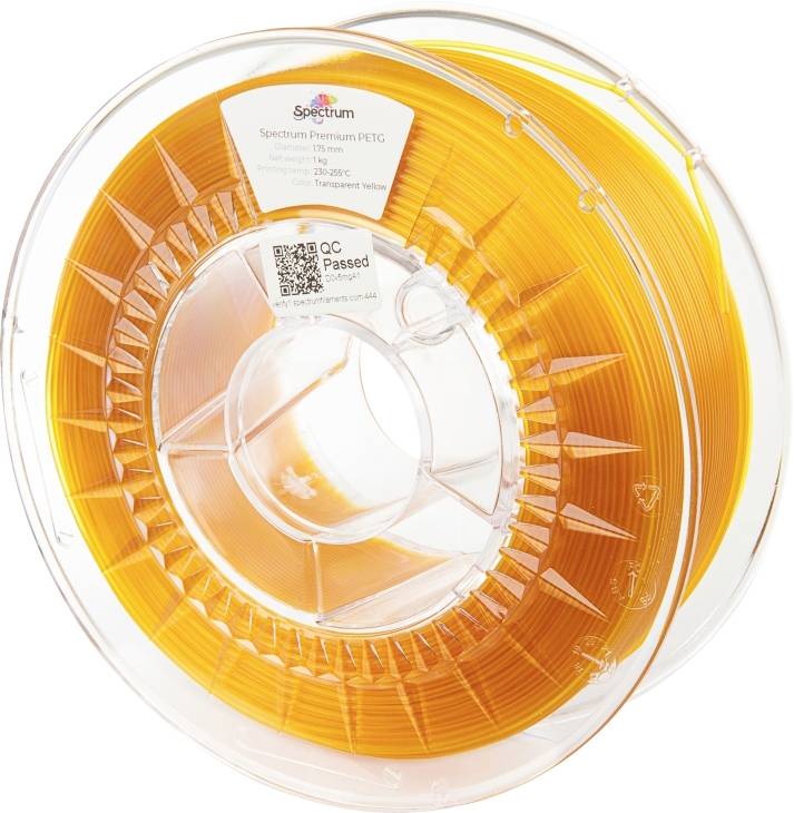 A spool of orange 3D printer filament. The label reads: 'Spectrum Premium PETG', diameter 1.75 mm, transparent orange.
