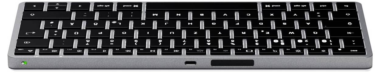 Compact black keyboard with QWERTZ layout and additional symbol keys. Slim design with silver trim.