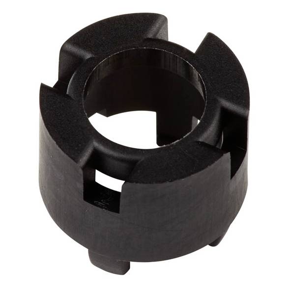 Black plastic mechanical component, cylindrically shaped with multiple recesses; presumably used in machinery.
