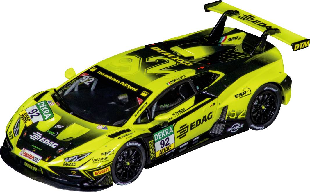 A yellow racing car with the number 92 and sponsor logos, driving on a racetrack.