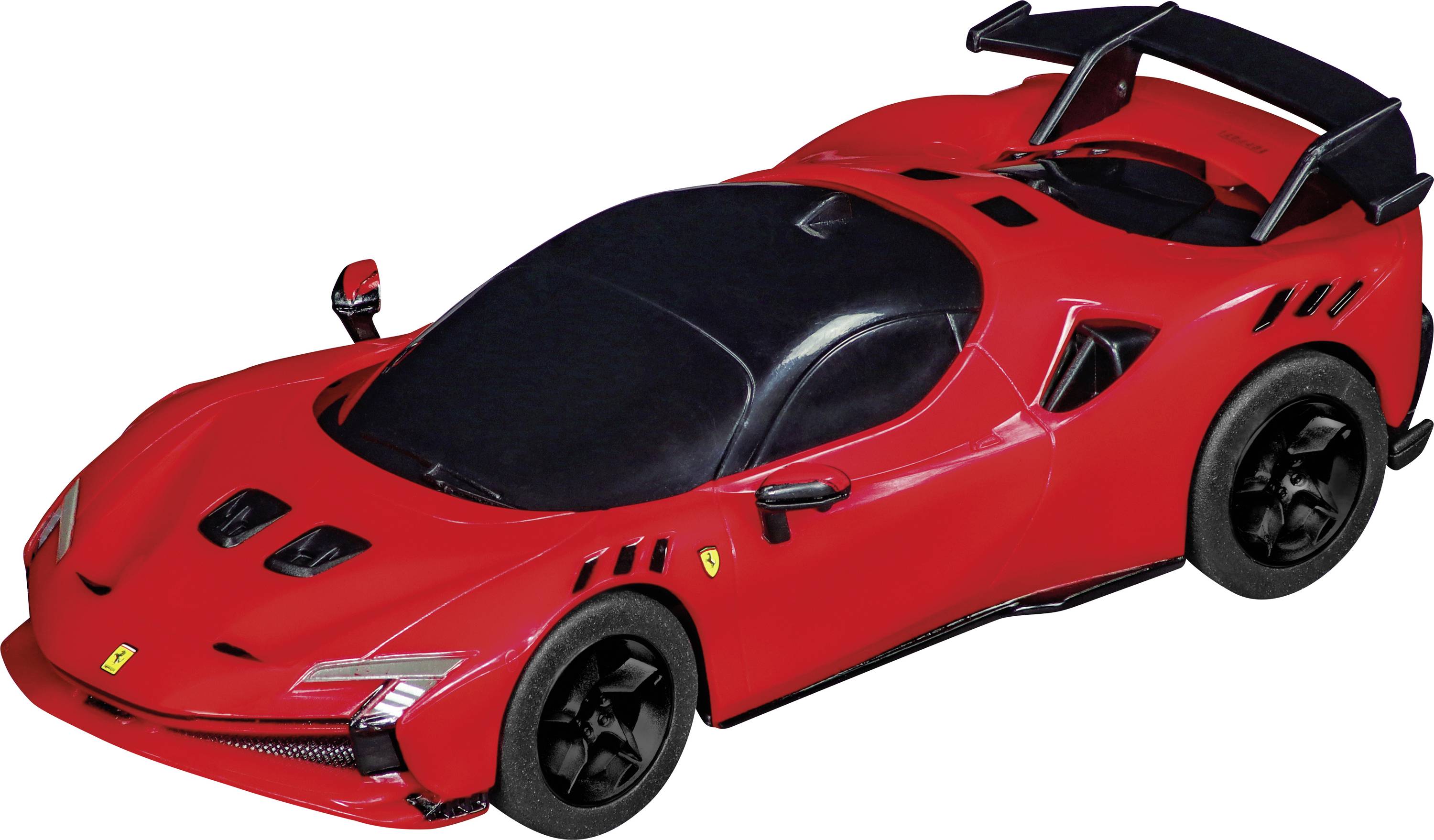 A red sports car with an aerodynamic design and a large rear spoiler. The car is standing on a black surface.
