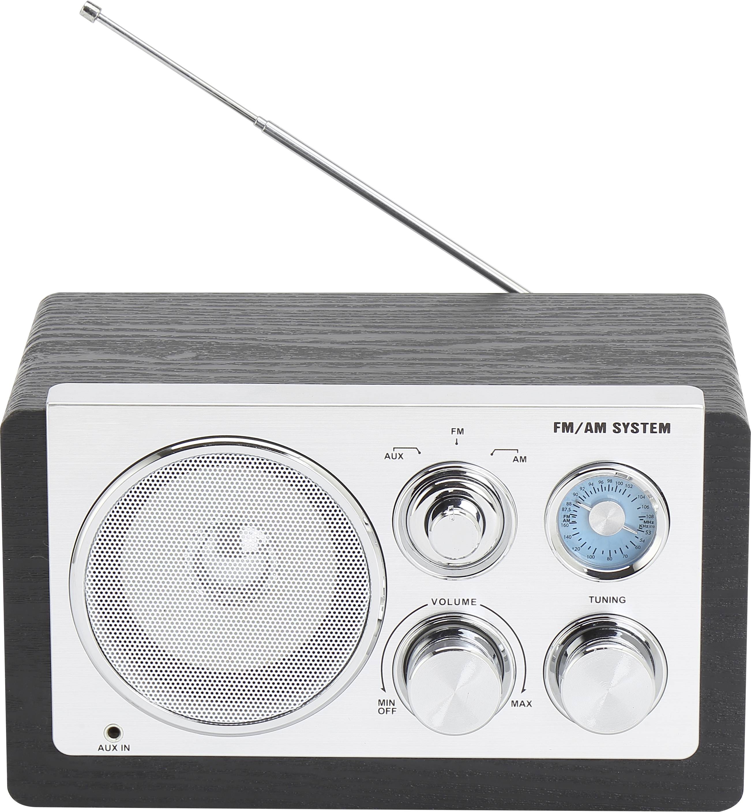 A retro radio with FM/AM system, black casing and silver control elements. Visible are volume controls and a tuning knob.