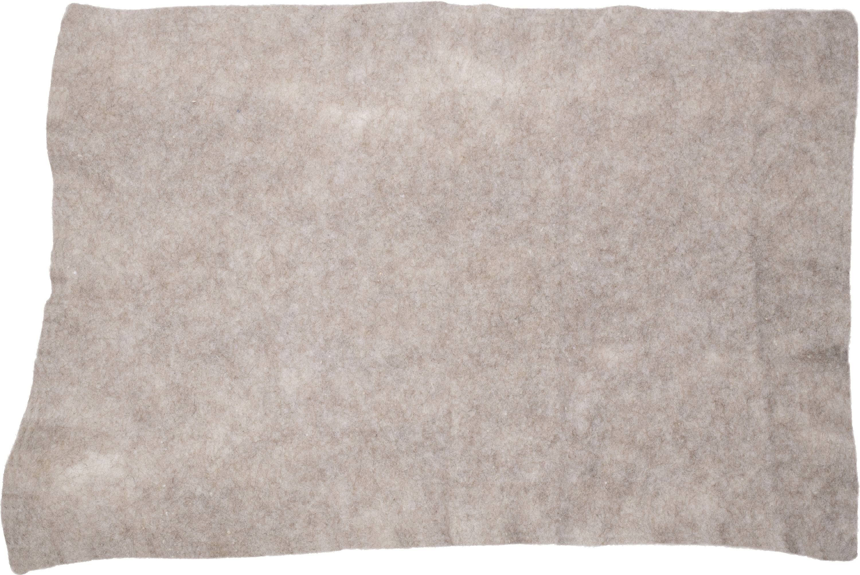 Brown felt piece on white background.