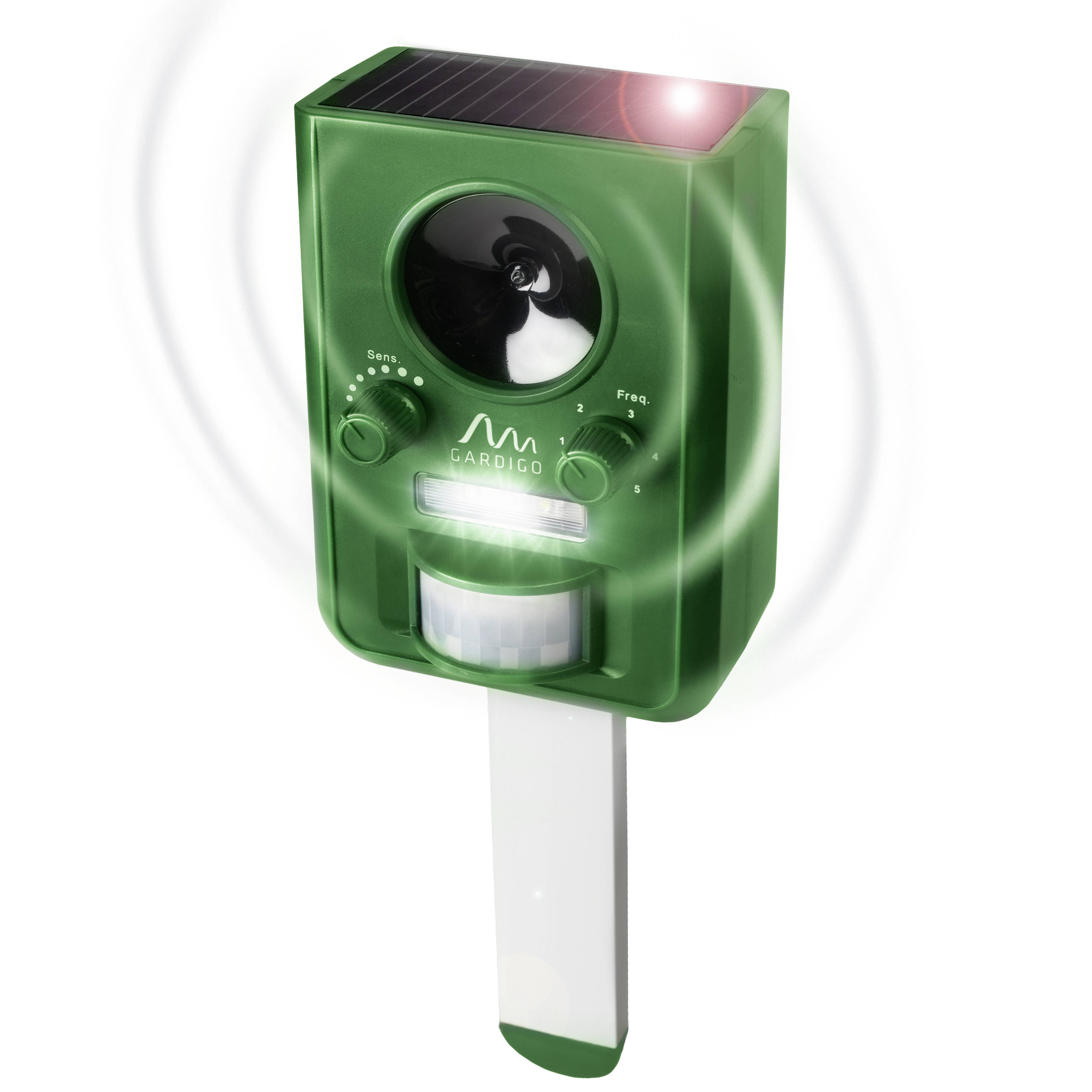 Green ultrasonic animal deterrent device with solar panel, control knobs and motion sensor, supported on a ground stake.