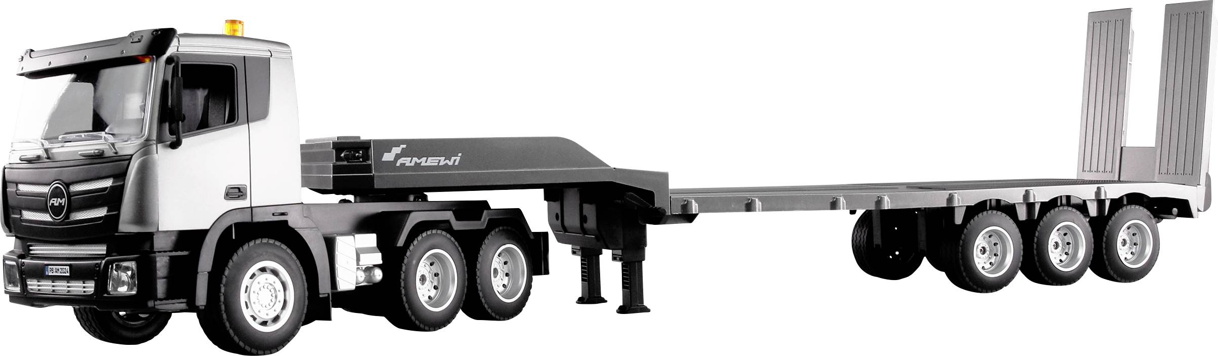 Black and white heavy-duty articulated lorry with a lowerable loading deck, ready for transporting heavy machinery or goods.
