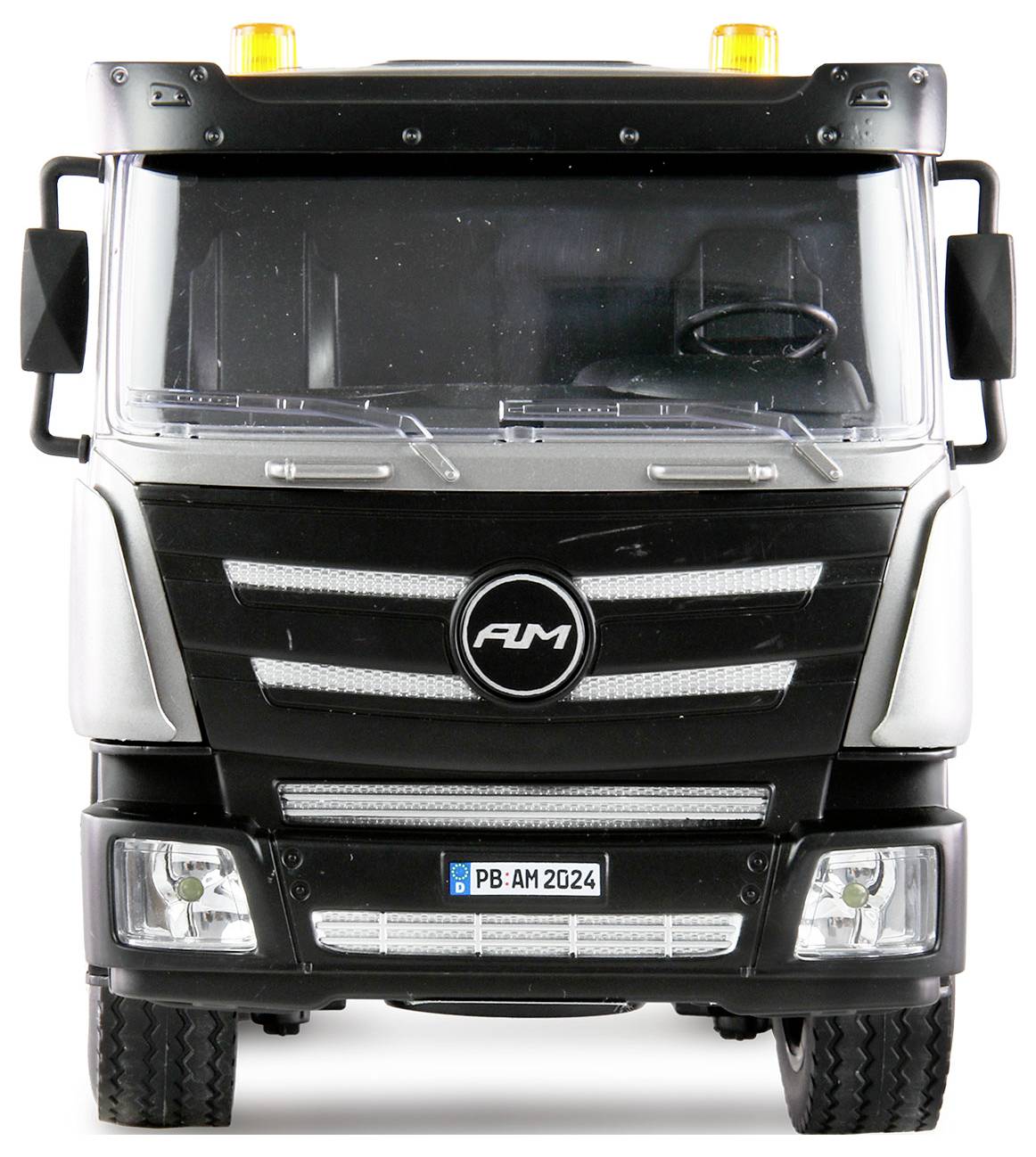 Black lorry from the front with illuminated yellow warning lights on the roof.