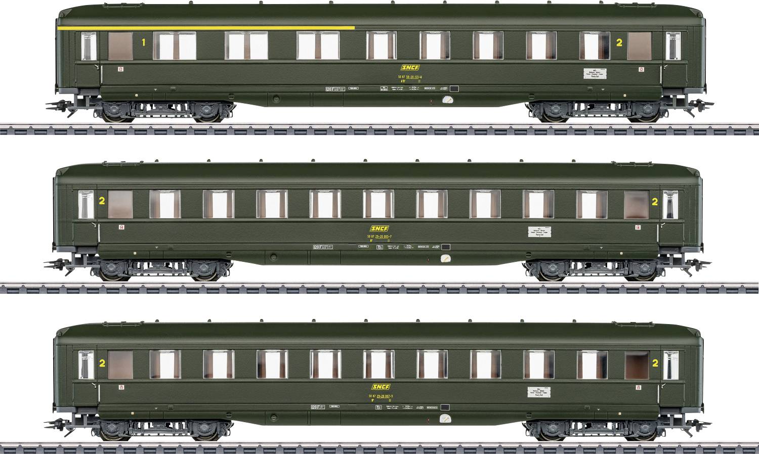 Three green passenger carriages of the Deutsche Reichsbahn on railway tracks, depicting model train carriages. Carriages with yellow '2' indicating second class.