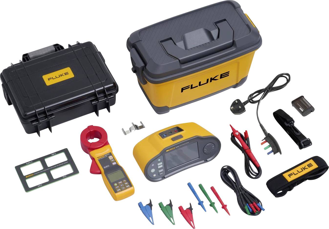 An electrical test kit with a yellow multimeter, clamp current transformer, coloured crocodile clips, power supply and protective case on a white background.