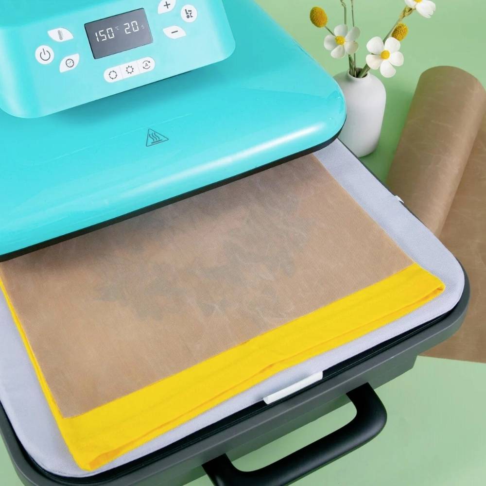 Digital iron with temperature display, hot on yellow fabric on pressing mat, next to a vase with flowers. Ideal for DIY projects.