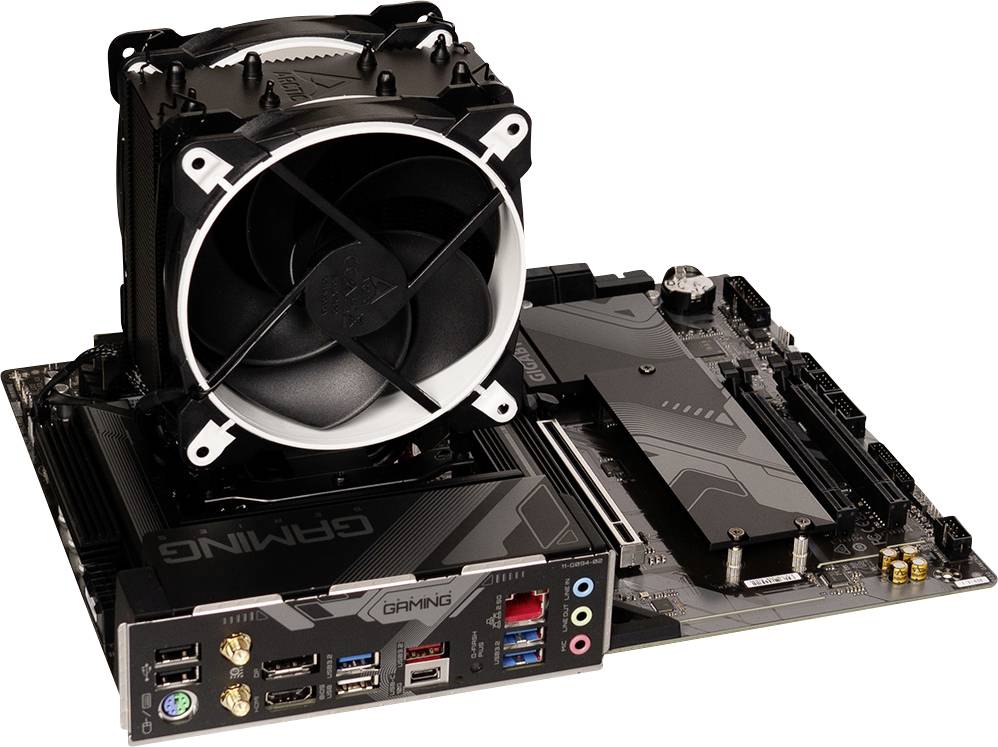 A computer motherboard with a large CPU cooler and multiple connection ports visible, including USB, audio, and network ports.