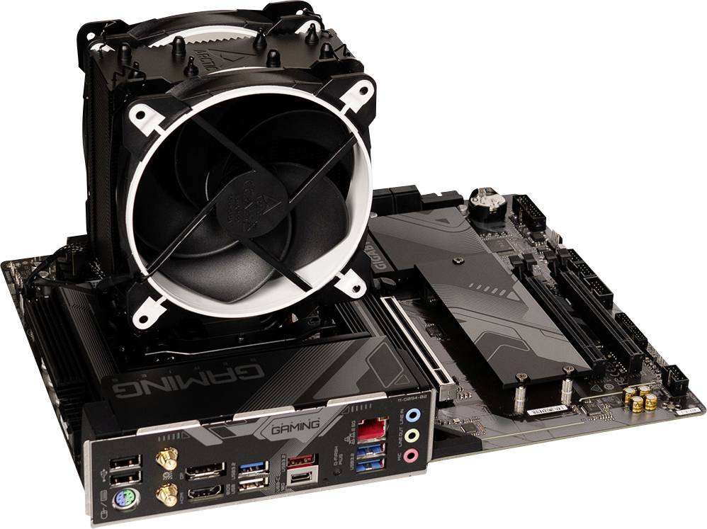 A motherboard with a large CPU cooler. Visible connections: USB ports, audio and video slots.