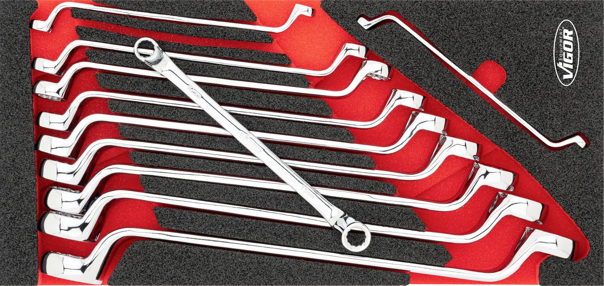 Set of twelve chrome-plated double ring spanners in a foam insert. A single curved tool handle positioned top right. Brand name 'VIGOR'.