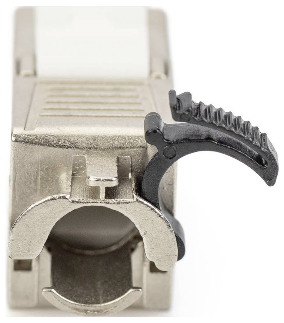 A close-up of a metal plug with a black plastic lever, used for connecting cables in electronic devices.