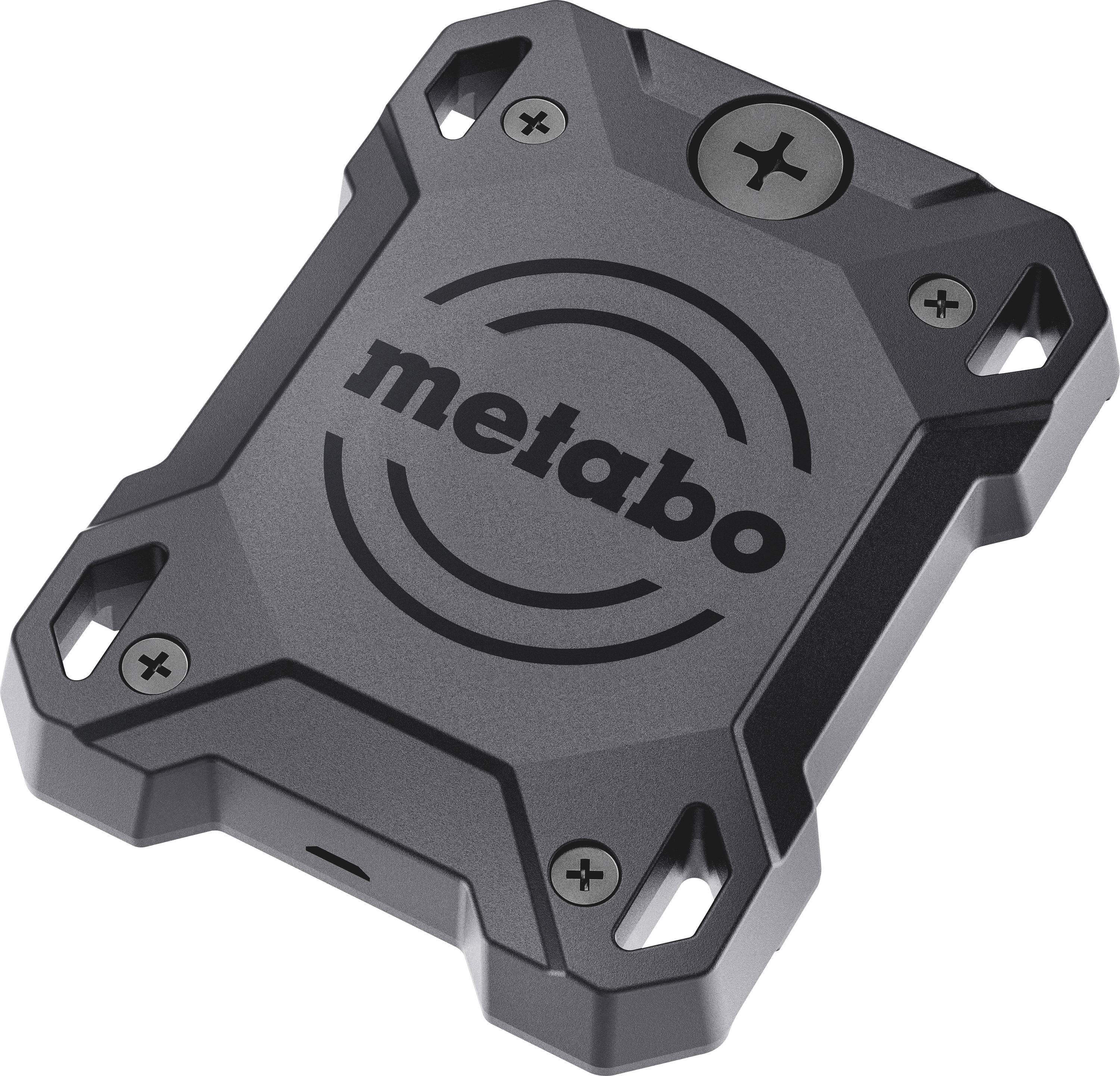 Black, rectangular Metabo power adapter with four screw holes at the corners, compact and robust design, top-down view.