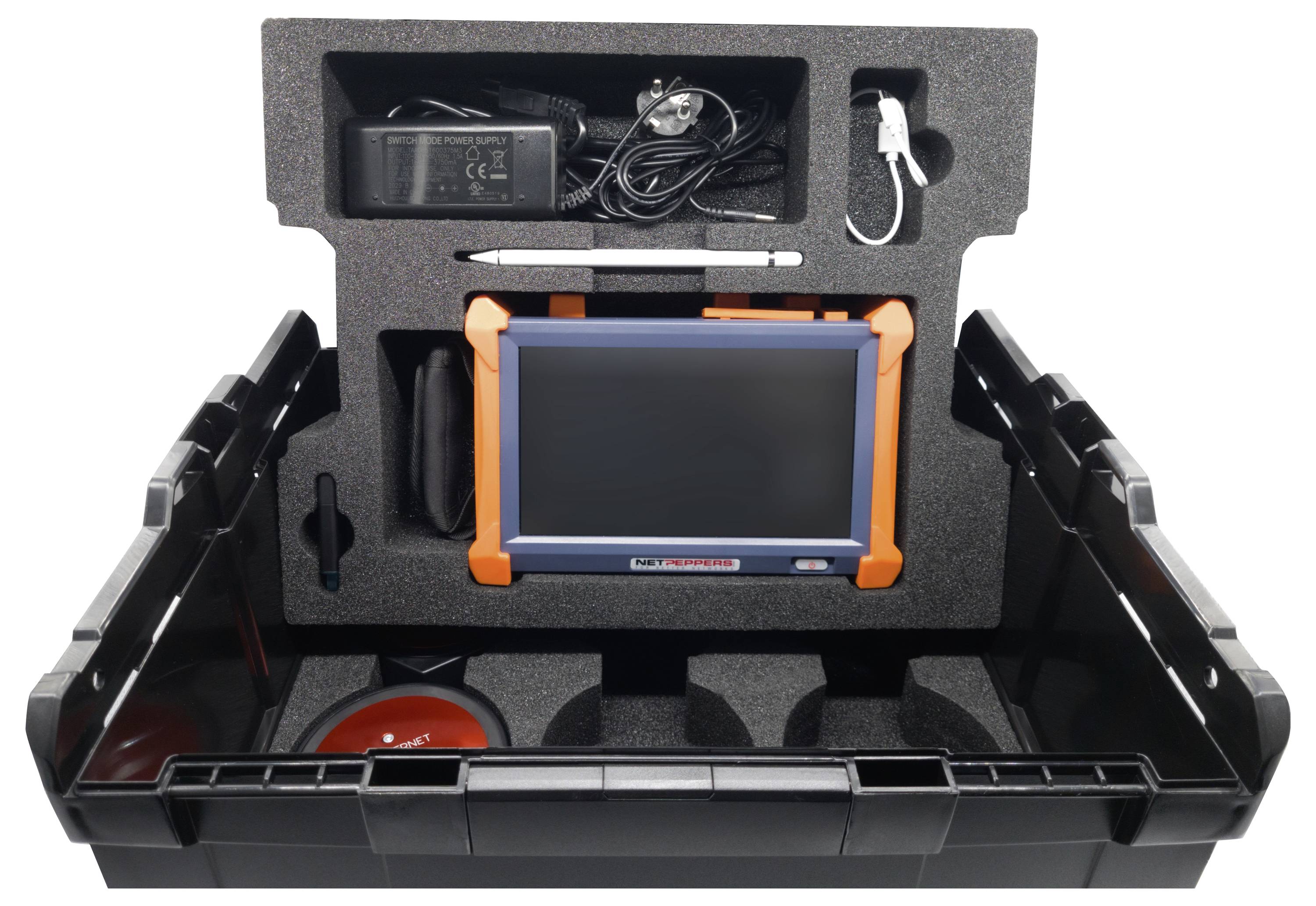 Diagnostic device in an open black case with charger, stylus and connectors. Suitable for automotive diagnostic tests.