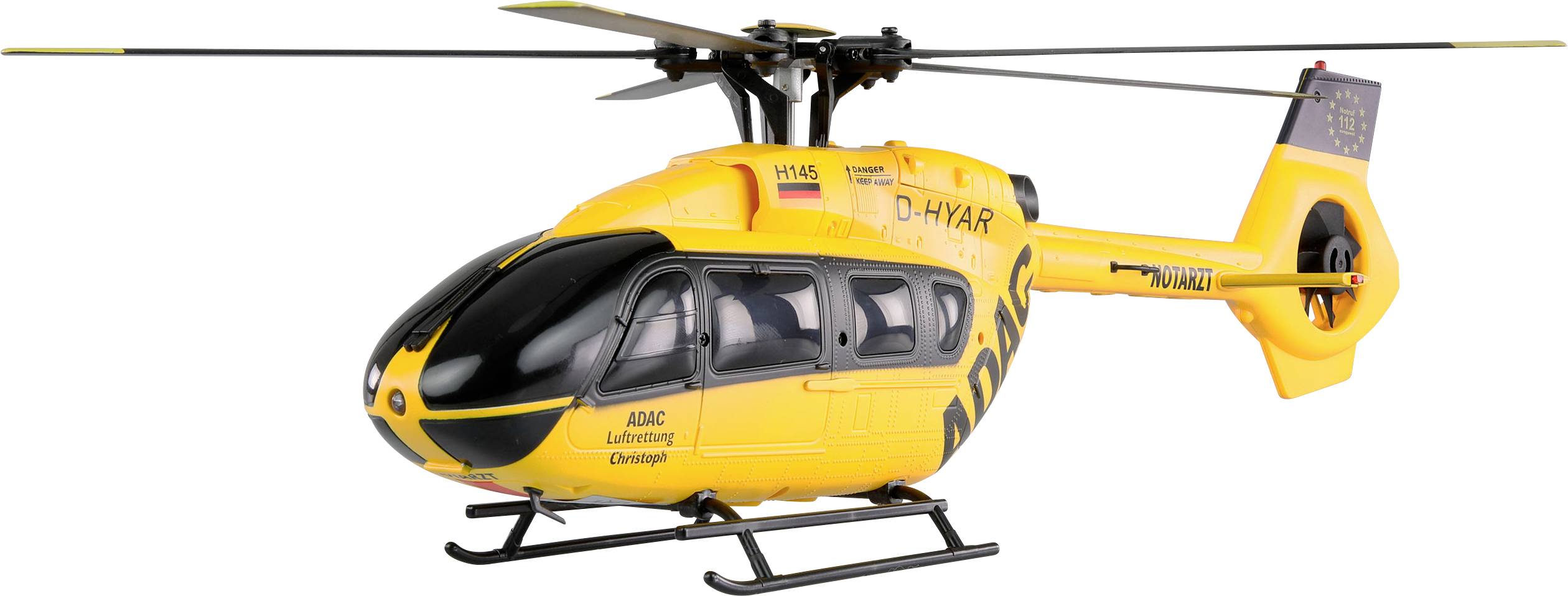 Yellow helicopter with 'ADAC' written on the side. It is in operation for rescue missions and has rotating rotor blades.